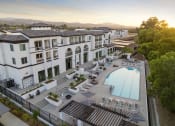 Thumbnail 20 of 69 - an aerial view of a hotel with a swimming pool at The Venue at Orange Apartments, Redlands