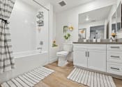 Thumbnail 60 of 69 - a white bathroom with a shower and a toilet