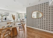 Thumbnail 46 of 69 - a dining room with a table and chairs and a mirror