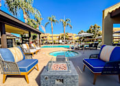 Thumbnail 21 of 36 - the pool area at our apartments fire pit with chairs