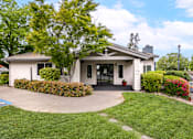 Thumbnail 3 of 31 - Leasing Office at Bent Tree Apartments surrounded by large trees