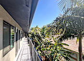 Thumbnail 4 of 23 - a balcony with a view of palm trees