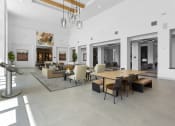 Thumbnail 2 of 69 - a large living room with a large table and chairs at The Venue at Orange Apartments, California, 92373