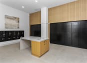 Thumbnail 18 of 69 - a wine room with black lockers and a counter and a wall of cabinets at The Venue at Orange Apartments, Redlands, CA, 92373