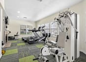 Thumbnail 8 of 37 - Fitness Center at California Place Apartments with plenty of equipment and large windows allowing for gorgeous natural lighting
