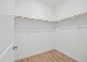 Thumbnail 30 of 38 - Spacious walk-in closet with dual hanging rods at Altitude Apartments, Moreno Valley