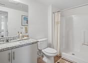 Thumbnail 21 of 38 - Bathroom with granite vanity and shower stall at Altitude Apartments, Moreno Valley, 92553