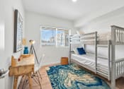 Thumbnail 22 of 38 - Bedroom with gray bunk beds and study desk at Altitude Apartments, California