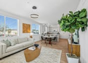 Thumbnail 16 of 38 - Open concept living and dining area with kitchen at Altitude Apartments, Moreno Valley, 92553