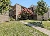 Thumbnail 14 of 37 - Charming exterior of California Place apartments with grass lined walkways and lush greenery, providing a beautiful and serene living experience!