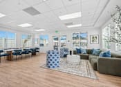 Thumbnail 5 of 38 - Community clubhouse with dining and lounge areas at Altitude Apartments, California, 92553