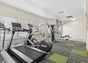 Thumbnail 7 of 37 - Fitness Center at California Place Apartments with plenty of equipment and large windows allowing for gorgeous natural lighting