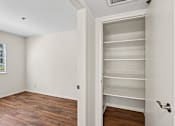 Thumbnail 17 of 26 - Bedroom inside Cielo Apartment home with plank flooring and large windows allowing for gorgeous natural lighting