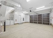 Thumbnail 35 of 38 - Spacious garage with washer dryer and storage at Altitude Apartments, Moreno Valley, California