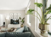 Thumbnail 6 of 12 - a living room with a couch and a coffee table