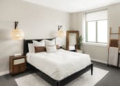 Thumbnail 8 of 12 - a bedroom with a bed and two windows