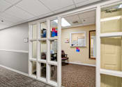 Thumbnail 14 of 37 - A room with a white door and a brown carpet at Hampton Apartments, Clearwater, Florida