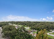Thumbnail 18 of 37 - A view of a residential area with houses and trees at Hampton Apartments, Clearwater, FL, 33759