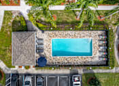Thumbnail 6 of 15 - Aerial View of the swimming pool at Pineview Apartments, in Clearwater, FL 33755