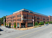 Thumbnail 27 of 46 - a large brick building on the corner of a street at 1400 Russell Apartments, Saint Louis, MO