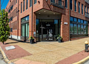 Thumbnail 22 of 46 - a brick building with a fire hydrant in front of it at 1400 Russell Apartments, Saint Louis, MO