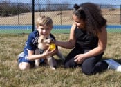 Thumbnail 13 of 33 - a boy and a girl playing with a dog at The Residences at Tesson Ridge, Missouri, 63128