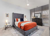 Thumbnail 18 of 33 - a bedroom with a bed and a window at The Residences at Tesson Ridge, Saint Louis