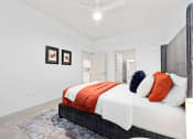 Thumbnail 26 of 33 - a bedroom with a bed and a closet at The Residences at Tesson Ridge, Missouri, 63128