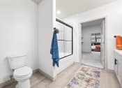 Thumbnail 28 of 33 - a bathroom with a toilet and a glass shower at The Residences at Tesson Ridge, Saint Louis, MO, 63128