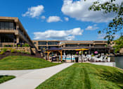Thumbnail 86 of 112 - A building with a pool in front of it. at The Residences at Tesson Ridge Apartments, Saint Louis, MO, 63128