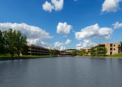 Thumbnail 1 of 33 - a view of a lake in front of a building