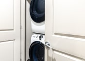 Thumbnail 54 of 54 - a washing machine and dryer in a small closet