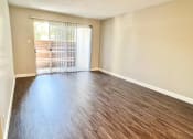 Thumbnail 13 of 37 - an empty living room with a sliding glass door