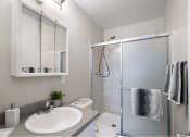 Thumbnail 4 of 31 - a bathroom with a sink shower and toilet in a 555 waverly unit