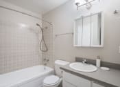 Thumbnail 3 of 31 - a bathroom with a sink toilet and bathtub