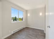 Thumbnail 14 of 17 - Bedroom with Hardwood Floors