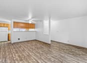 Thumbnail 26 of 27 - A room with wooden flooring and white walls.
