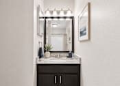 Thumbnail 22 of 40 - A bathroom with a sink, mirror, and cabinet.