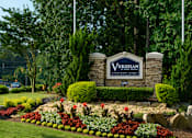 Thumbnail 40 of 40 - A sign that says "Verdian" in front of a flower bed.