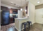 Thumbnail 4 of 27 - Model Kitchen with Bar Top