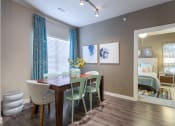 Thumbnail 7 of 27 - Model Dining Room with Track Lighting