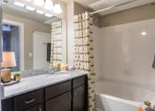 Thumbnail 9 of 27 - Model  Bathroom with Shower/Soaking Tub