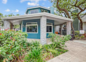 Thumbnail 7 of 25 - a blue and white bungalow with a tree in the background