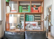 Thumbnail 11 of 22 - bookshelf room divider between living room and bedroom in apartment at Myers Medical Lofts