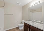 Thumbnail 17 of 19 - a bathroom with a sink toilet and a mirror