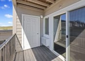 Thumbnail 13 of 19 - the door to the balcony is open to the patio