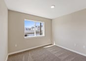 Thumbnail 12 of 19 - an empty bedroom with a window and carpet