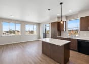 Thumbnail 1 of 13 - an open kitchen and living room with a large island