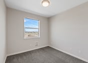 Thumbnail 6 of 13 - an empty room with carpet and a window