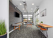 Thumbnail 22 of 48 - an open office space with tables and chairs and a large window